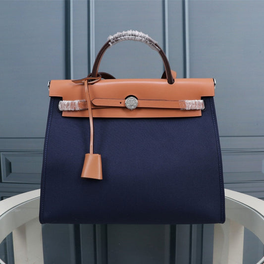 HM HERBAG ZIP 31 LONA AZUL MARINO Y BRONCE