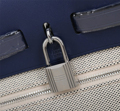 HM HERBAG ZIP 31 LONA CON MONOGRAMA AZUL MARINO Y CREMA