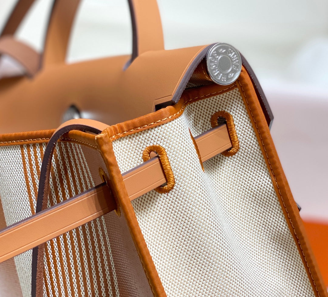 Herbag 31 Toile Lona Oro Blanco Piel Vaca Dorada