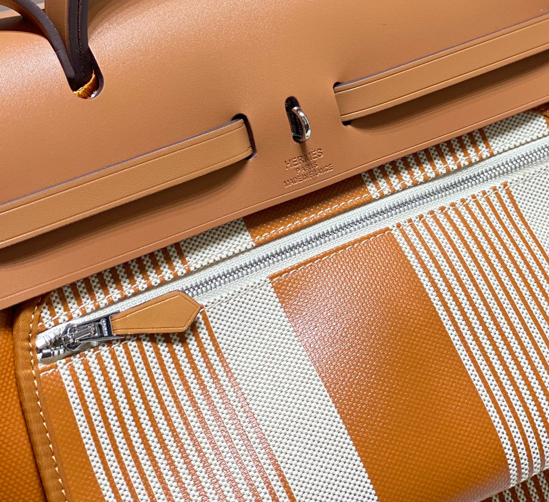Herbag 31 Toile Lona Oro Blanco Piel Vaca Dorada