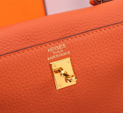 BOLSO HM KELLY 25 NARANJA TOGO HARDWARE DORADO