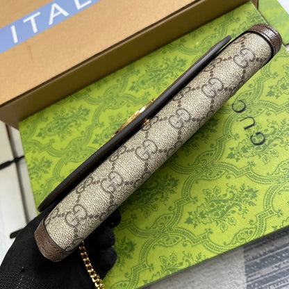 BOLSO DE HOMBRO BLONDIE 21 EN LONA BEIGE CON MONOGRAMA Y RIBETE DE PIEL DE BECERRO MARRÓN OSCURO CON HERRAJES DORADOS