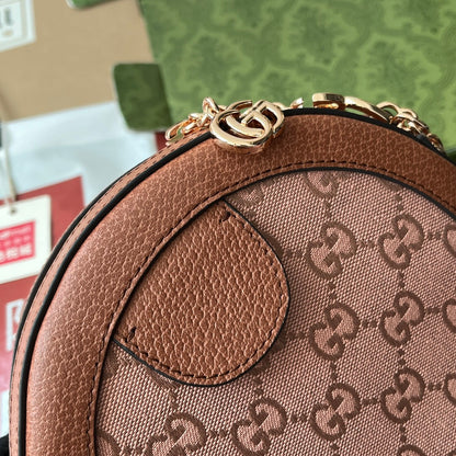 BOLSO DE HOMBRO OPHIDIA MINI REDONDO DE 18" EN LONA ROSA RUBORIZADO Y ADORNO DE CUERO MARRÓN