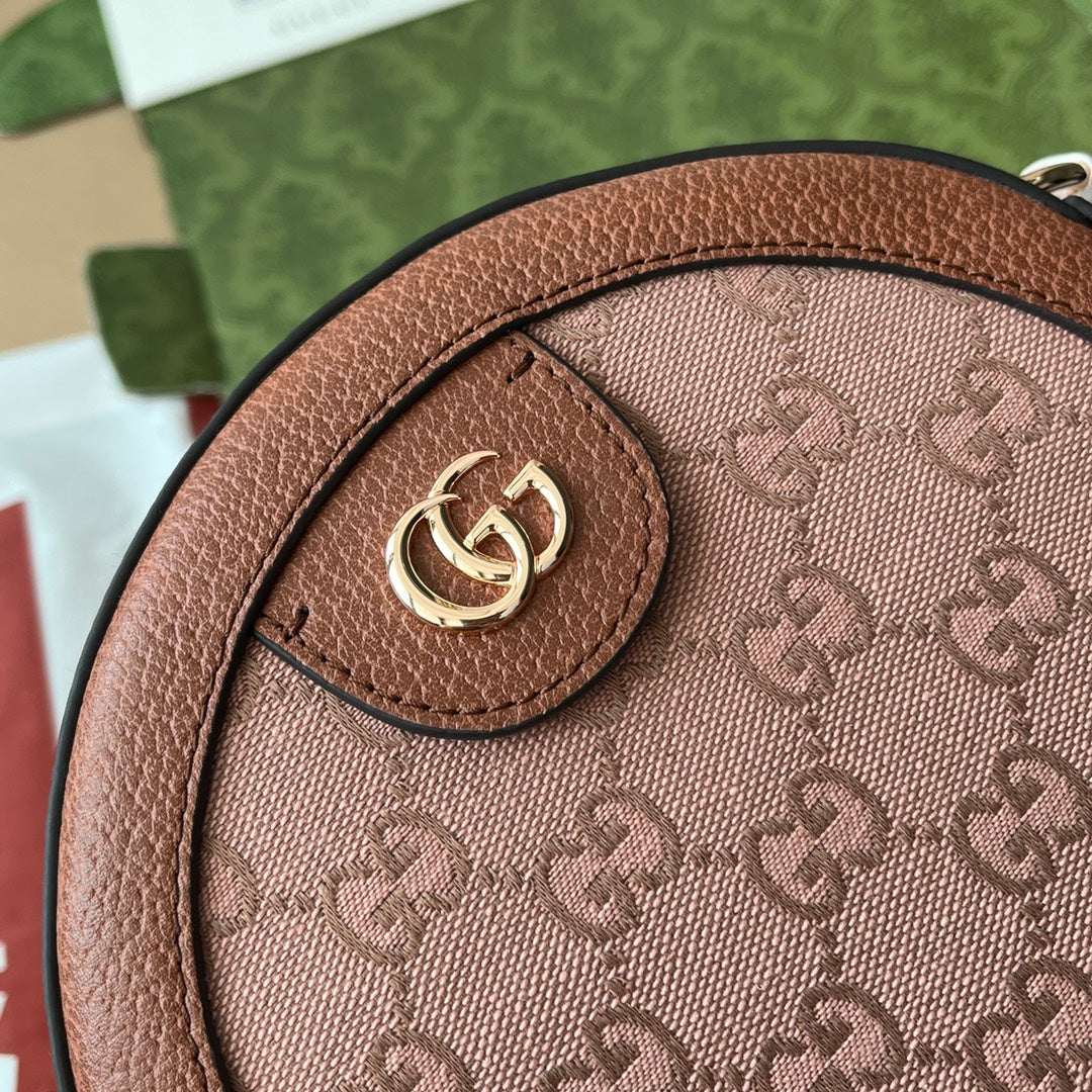 BOLSO DE HOMBRO OPHIDIA MINI REDONDO DE 18" EN LONA ROSA RUBORIZADO Y ADORNO DE CUERO MARRÓN