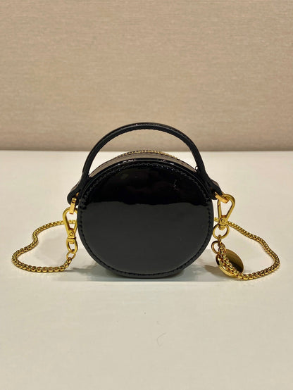 MINI BOLSO REDONDO 8 EN PIEL DE BECERRO NEGRA BRILLANTE CON HERRAJES DORADOS