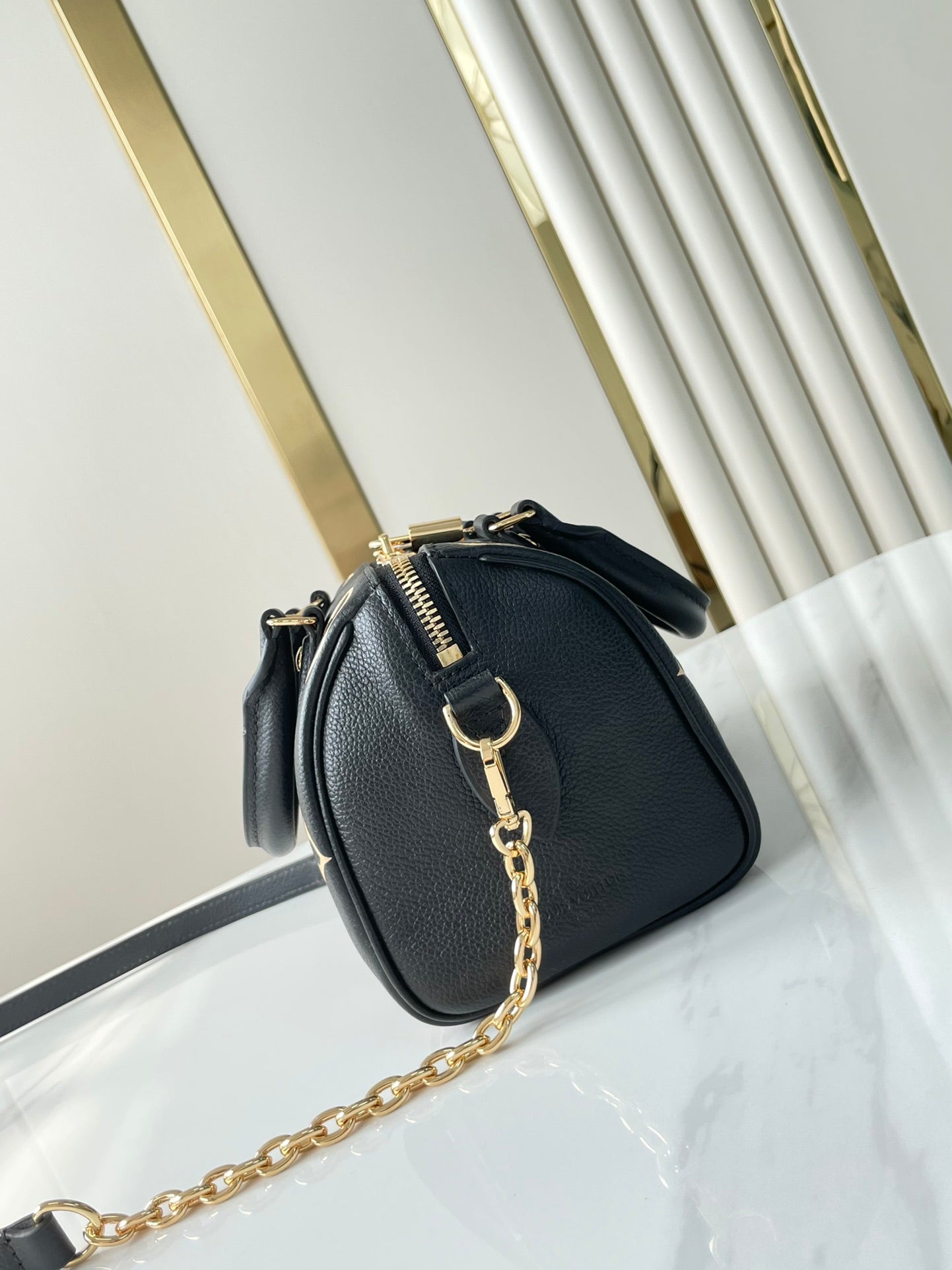 SPEEDY BANDOULI¨¨RE 20 EN CUERO NEGRO CREMA CON MONOGRAMA IMPRESO Y HERRAJES DORADOS