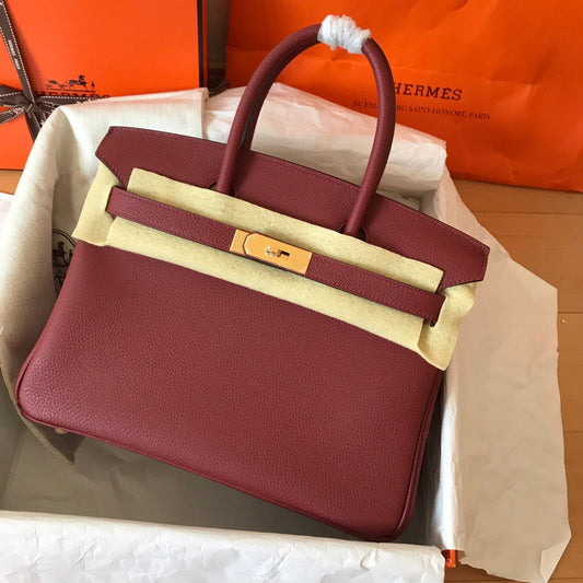 HM BIRKIN 25 CM VINO TINTO TOGO PIEL HIERROS DORADOS