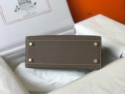HM KELLY 25 ETOUPE EPSOM CUERO HIERROS DORADOS
