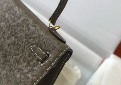 HM KELLY 25 ETOUPE EPSOM CUERO HIERROS DORADOS