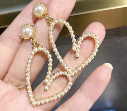 PENDIENTES DE CORAZÓN ABIERTO BAÑADOS EN ORO CON PERLA