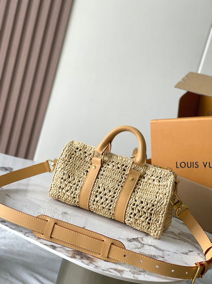 KEEPALL BANDOULI¨¨RE 25 EN RAFIA DE GANCHILLO BEIGE Y RIBETE DE PIEL DE BECERRO