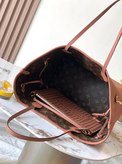 NEVERFULL INSIDE OUT MM 31 EN LONA MARRÓN CON MONOGRAMA Y RIBETE DE PIEL DE BECERRO