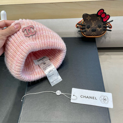 GORRO DE PUNTO A RAYAS EN LANA ROSA CLARO 424515 