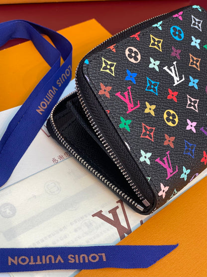 Monedero Zippy LV x TM de lona negra con monograma multicolor