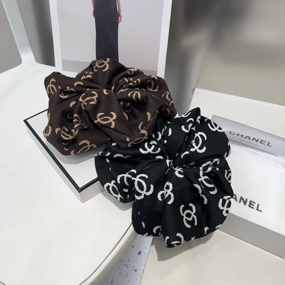 Coletero de tela con monograma negro 412544