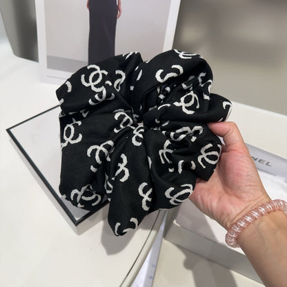 Coletero de tela con monograma negro 412544