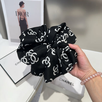 Coletero de tela con monograma negro 412544