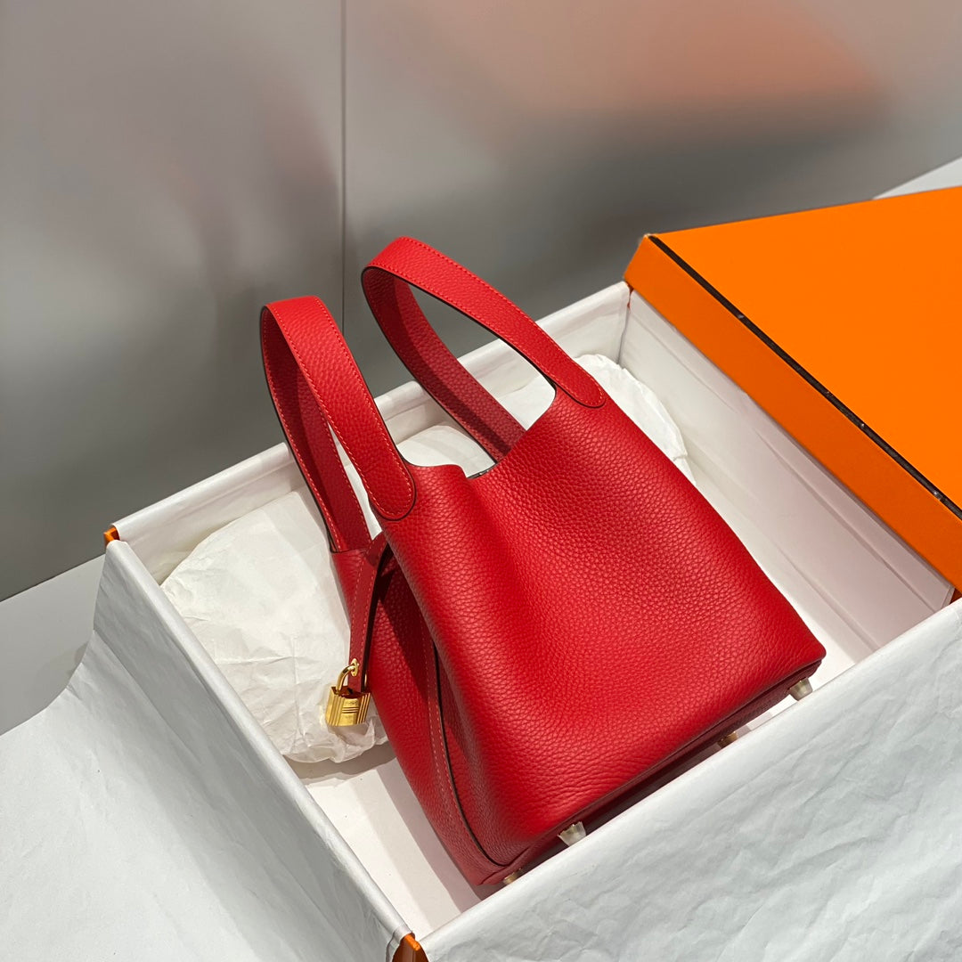Cerradura de picotina, cuero Togo rojo, herrajes dorados