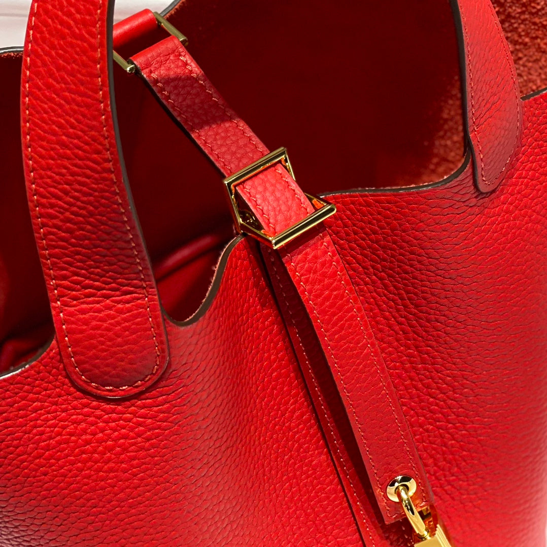 Cerradura de picotina, cuero Togo rojo, herrajes dorados