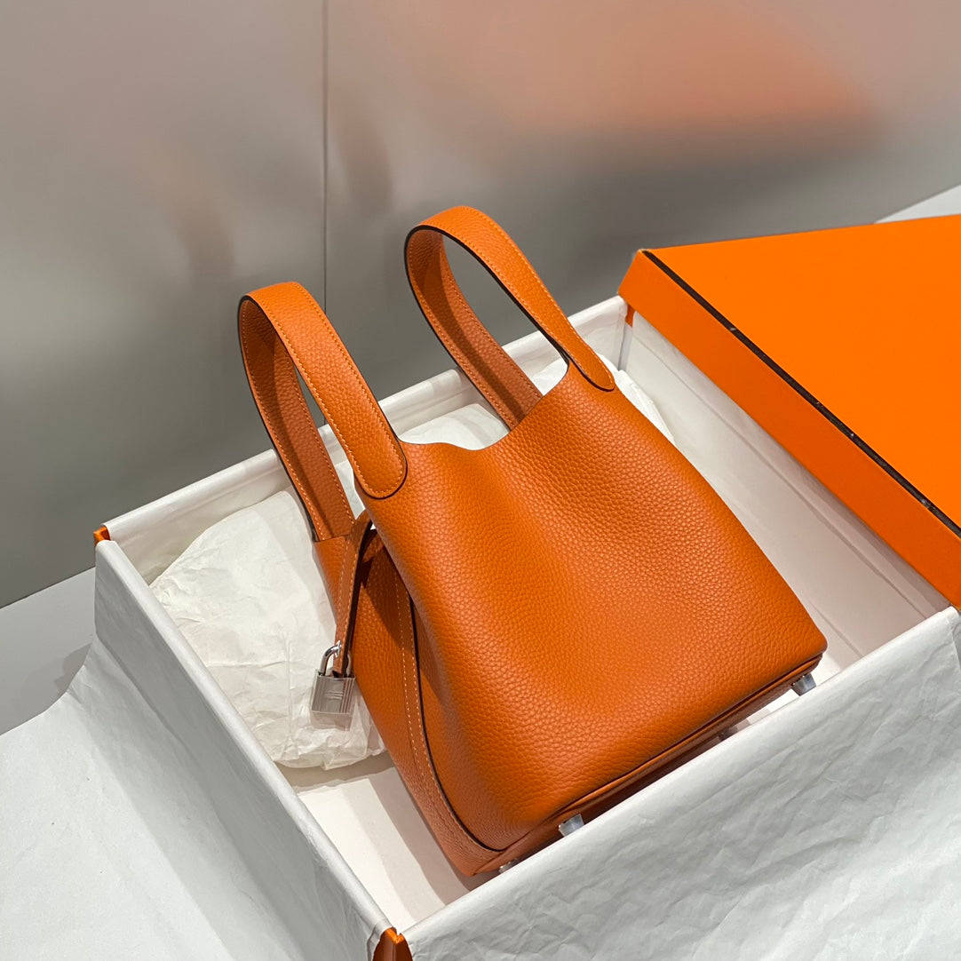 Cerradura de picotina, color naranja oscuro, cuero Togo, herrajes dorados