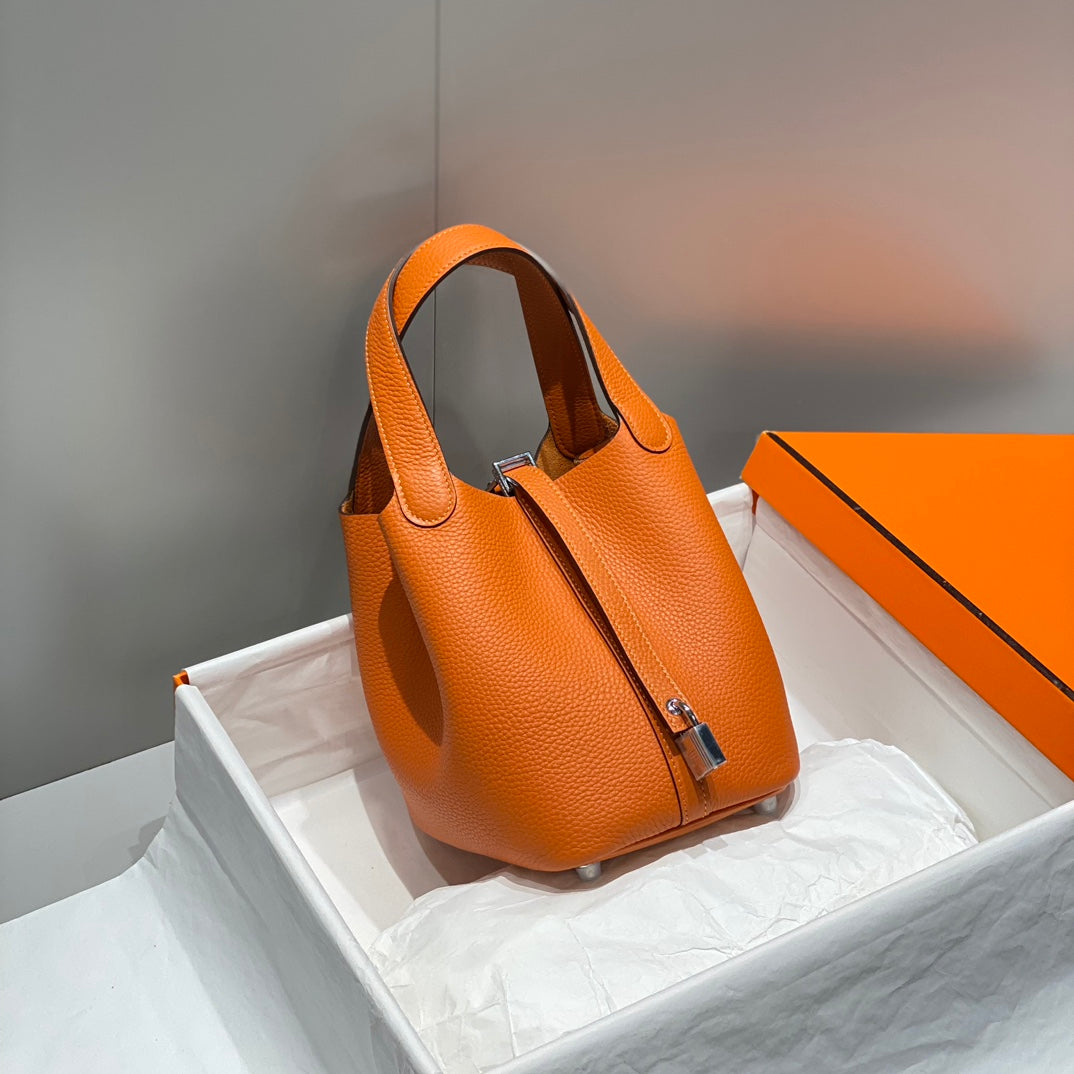 Cerradura de picotina, color naranja oscuro, cuero Togo, herrajes dorados