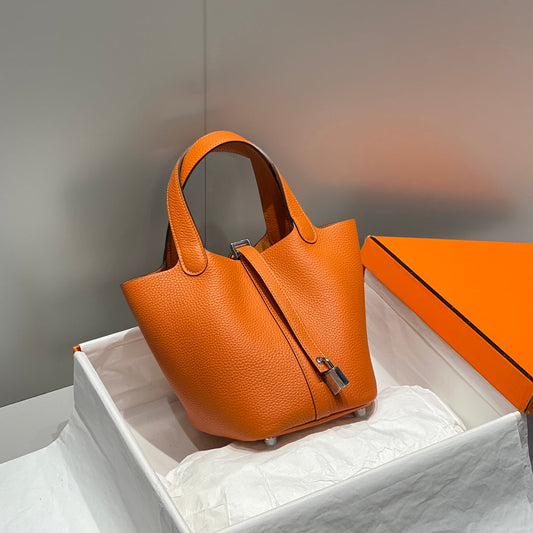 Cerradura de picotina, color naranja oscuro, cuero Togo, herrajes dorados