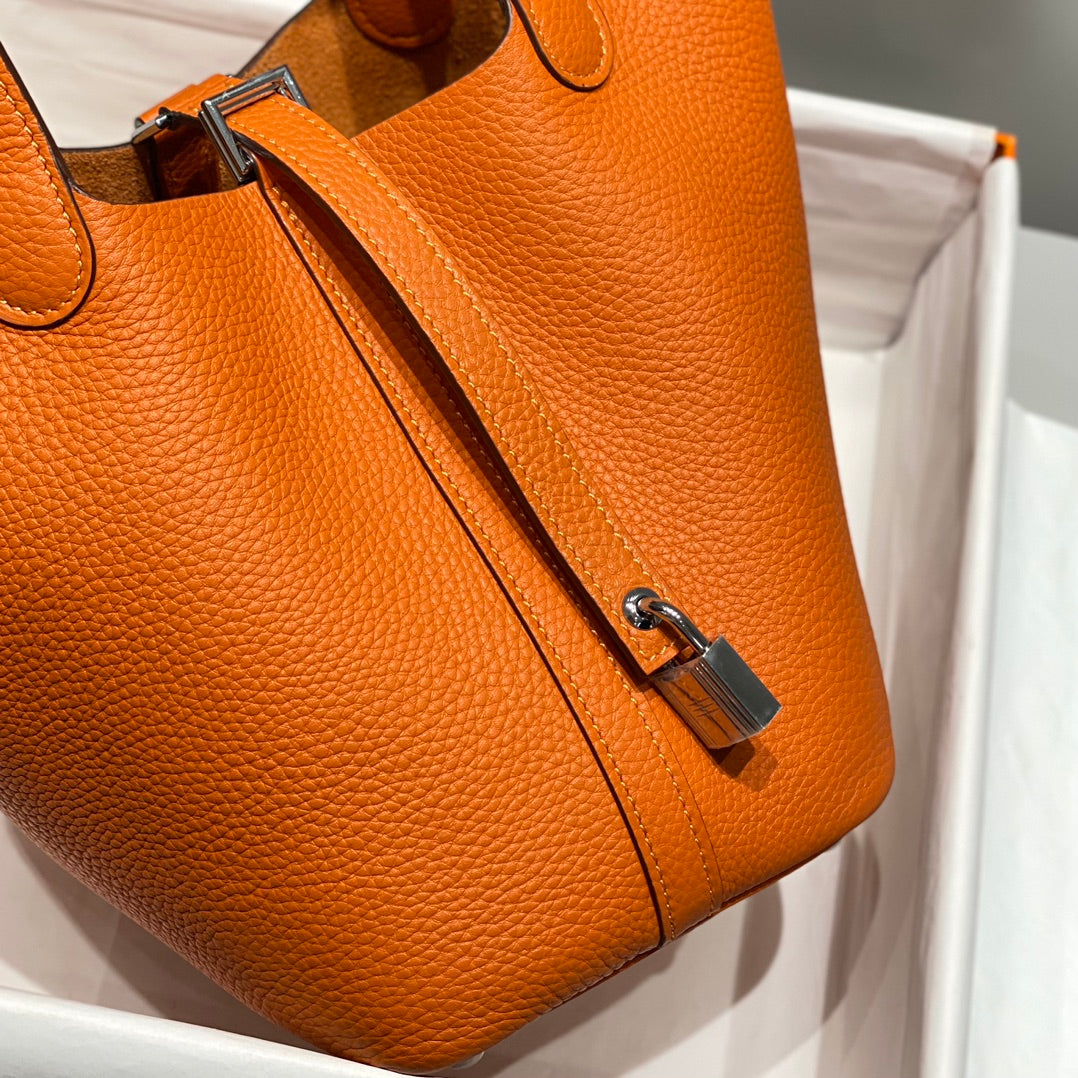 Cerradura de picotina, color naranja oscuro, cuero Togo, herrajes dorados