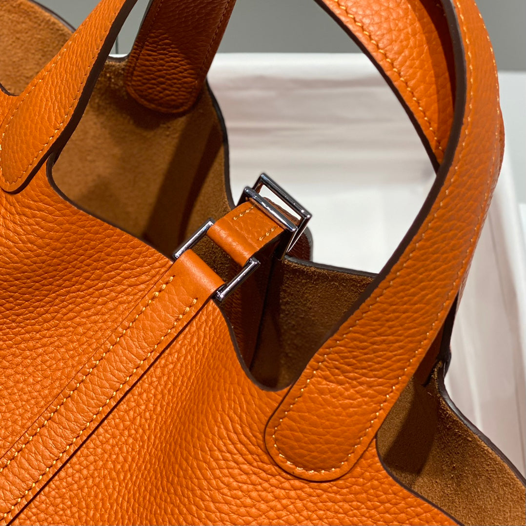 Cerradura de picotina, color naranja oscuro, cuero Togo, herrajes dorados
