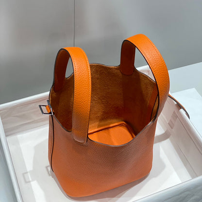 Cerradura de picotina, color naranja oscuro, cuero Togo, herrajes dorados