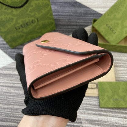 CARTERA CONTINENTAL 19 EN PIEL DE BECERRO REVESTIDA ROSA CON HERRAJES DORADOS