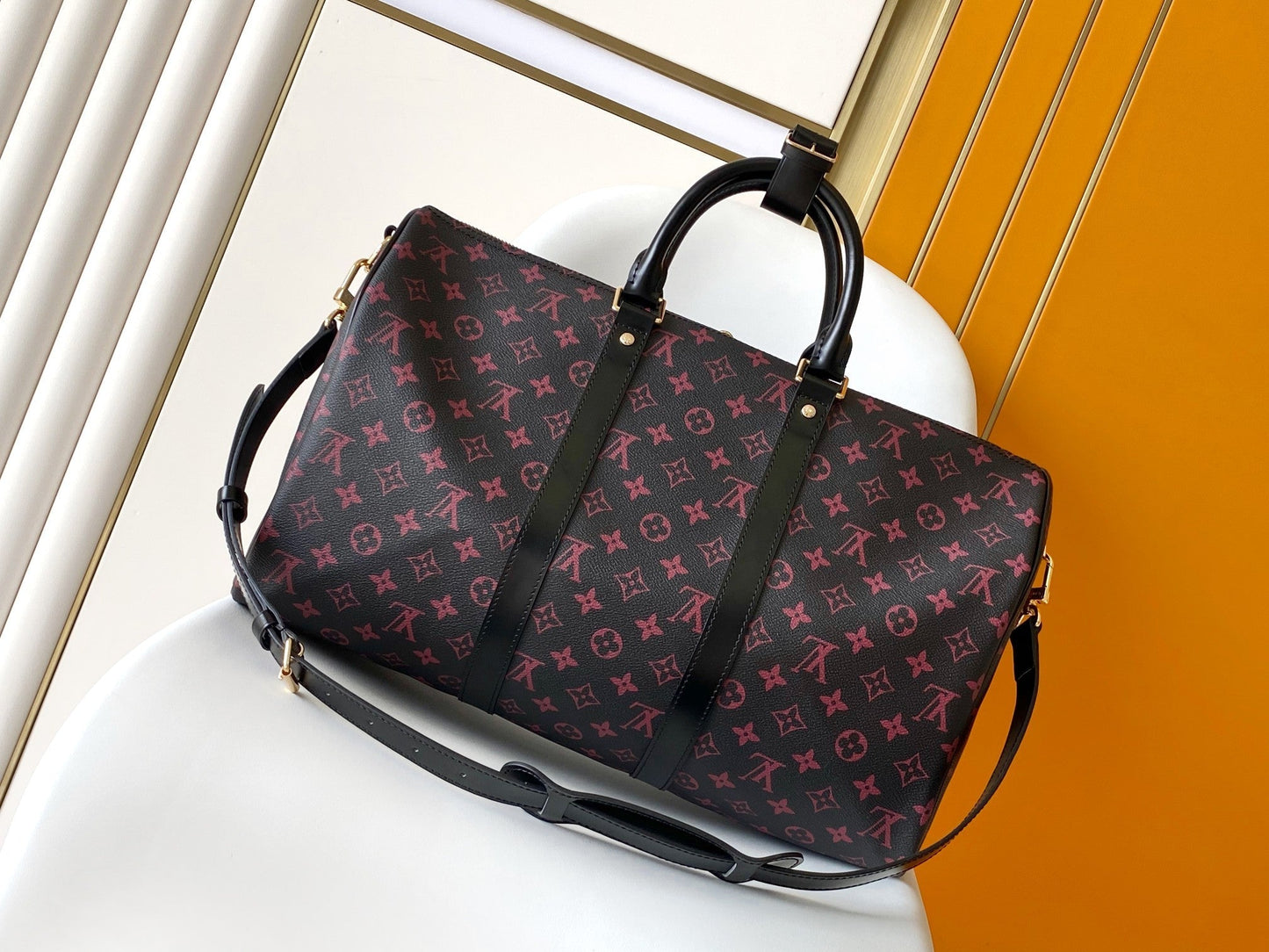 KEEPALL BANDOULI¨¨RE 45 EN LONA TOMETTE CON MONOGRAMA NEGRO