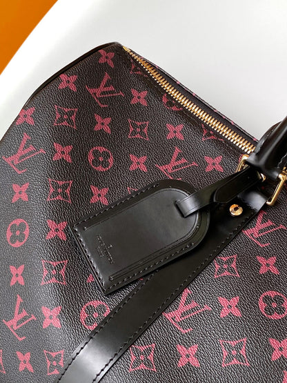 KEEPALL BANDOULI¨¨RE 45 EN LONA TOMETTE CON MONOGRAMA NEGRO