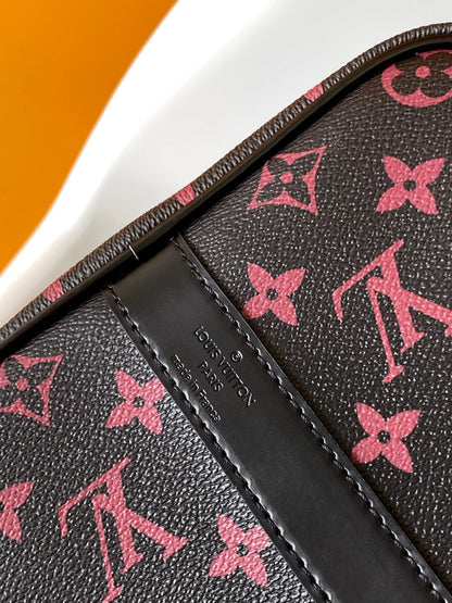 KEEPALL BANDOULI¨¨RE 45 EN LONA TOMETTE CON MONOGRAMA NEGRO