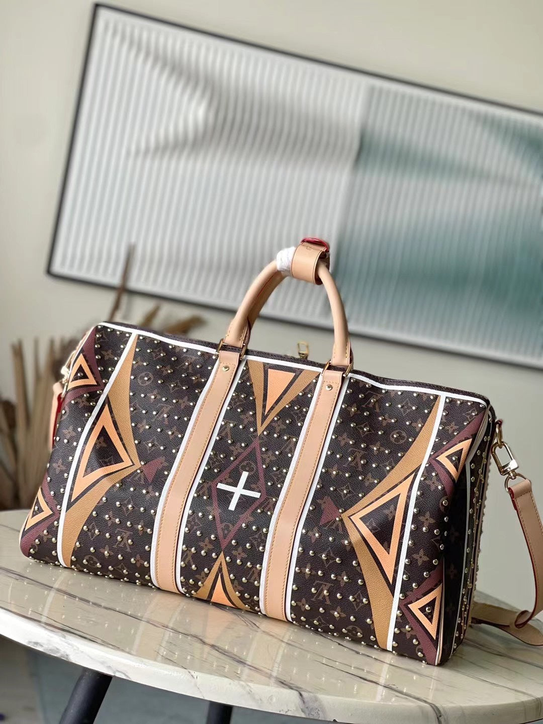 KEEPALL BANDOULI¨¨RE 50 EN LONA CON MONOGRAMA Y PATRÓN DE PARFLECHE