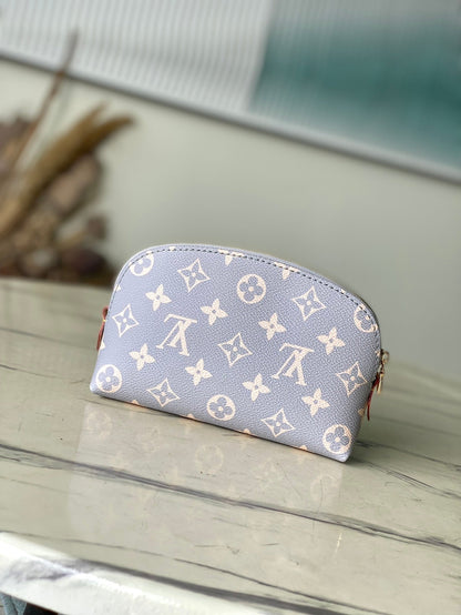 POCHETTE COSMÉTICO PM 19 EN LONA TRIANON CON MONOGRAMA GRIS CREMA