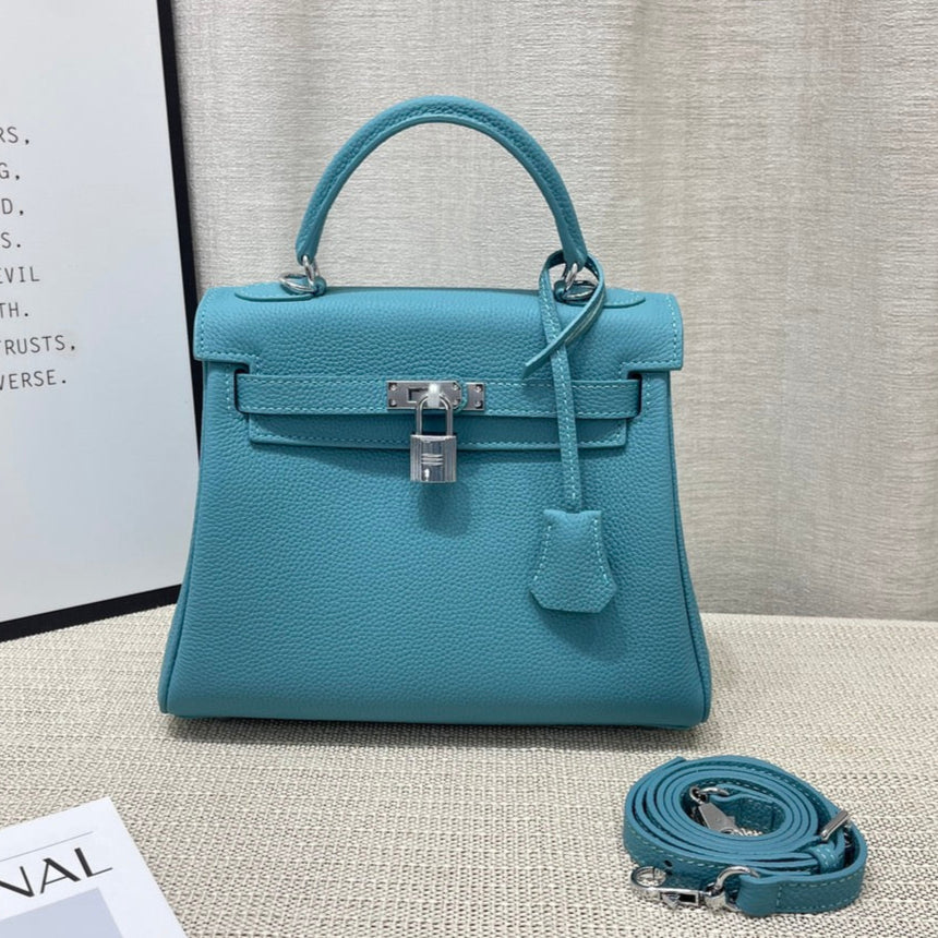 Bolso HM Kelly Retourne de 25 cm con piel de Togo turquesa y herrajes plateados