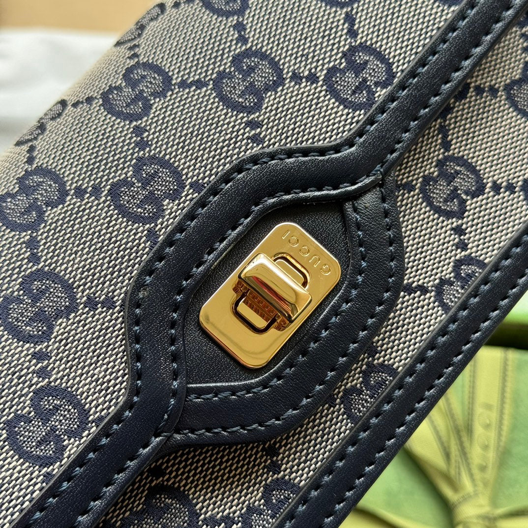 BOLSO DE HOMBRO LUCE MINI 20 EN LONA GRIS CLARO Y ADORNOS DE PIEL DE BECERRO NEGRA CON HERRAJES DORADOS