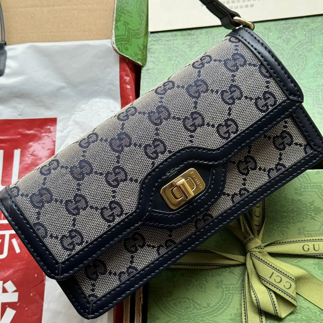 BOLSO DE HOMBRO LUCE MINI 20 EN LONA GRIS CLARO Y ADORNOS DE PIEL DE BECERRO NEGRA CON HERRAJES DORADOS