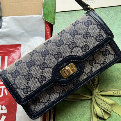 BOLSO DE HOMBRO LUCE MINI 20 EN LONA GRIS CLARO Y ADORNOS DE PIEL DE BECERRO NEGRA CON HERRAJES DORADOS