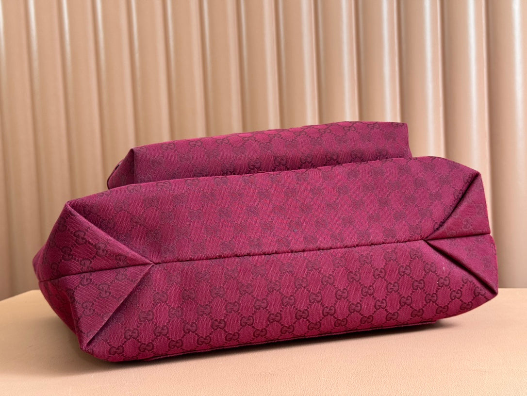 BOLSO DE MANO GRANDE DE 45 EN LONA CON MONOGRAMA COLOR ROJO VINO