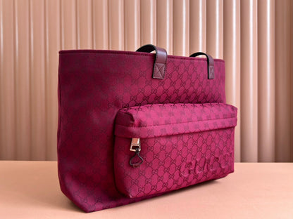 BOLSO DE MANO GRANDE DE 45 EN LONA CON MONOGRAMA COLOR ROJO VINO