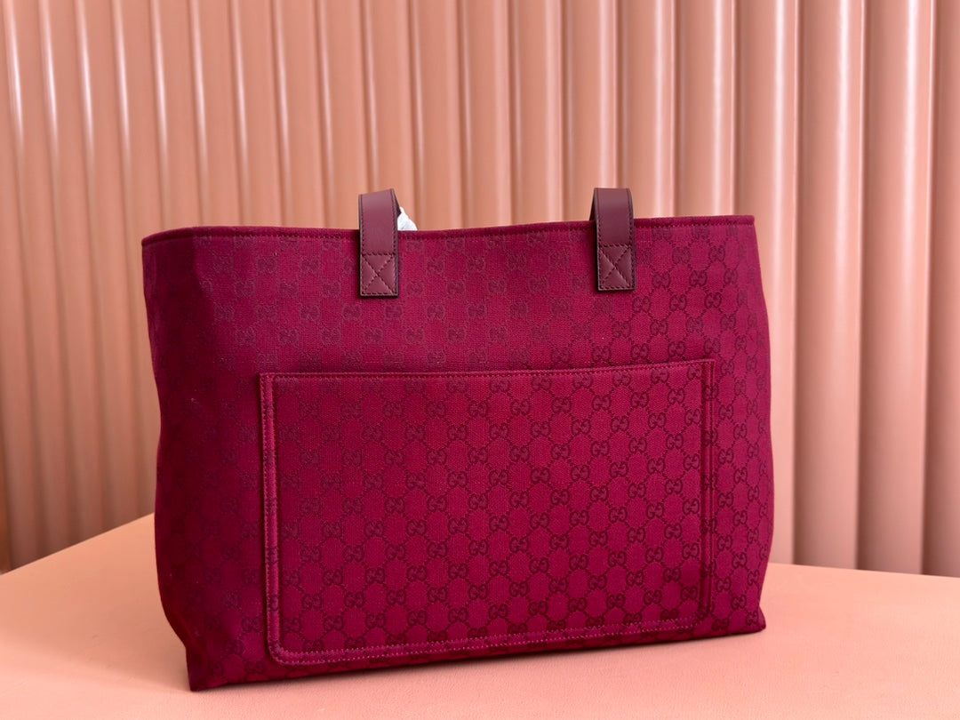 BOLSO DE MANO GRANDE DE 45 EN LONA CON MONOGRAMA COLOR ROJO VINO
