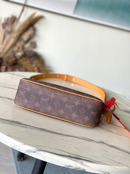 BOLSO DE ACCESORIO XL 28 EN LONA POLVO CON MONOGRAMA MARRÓN