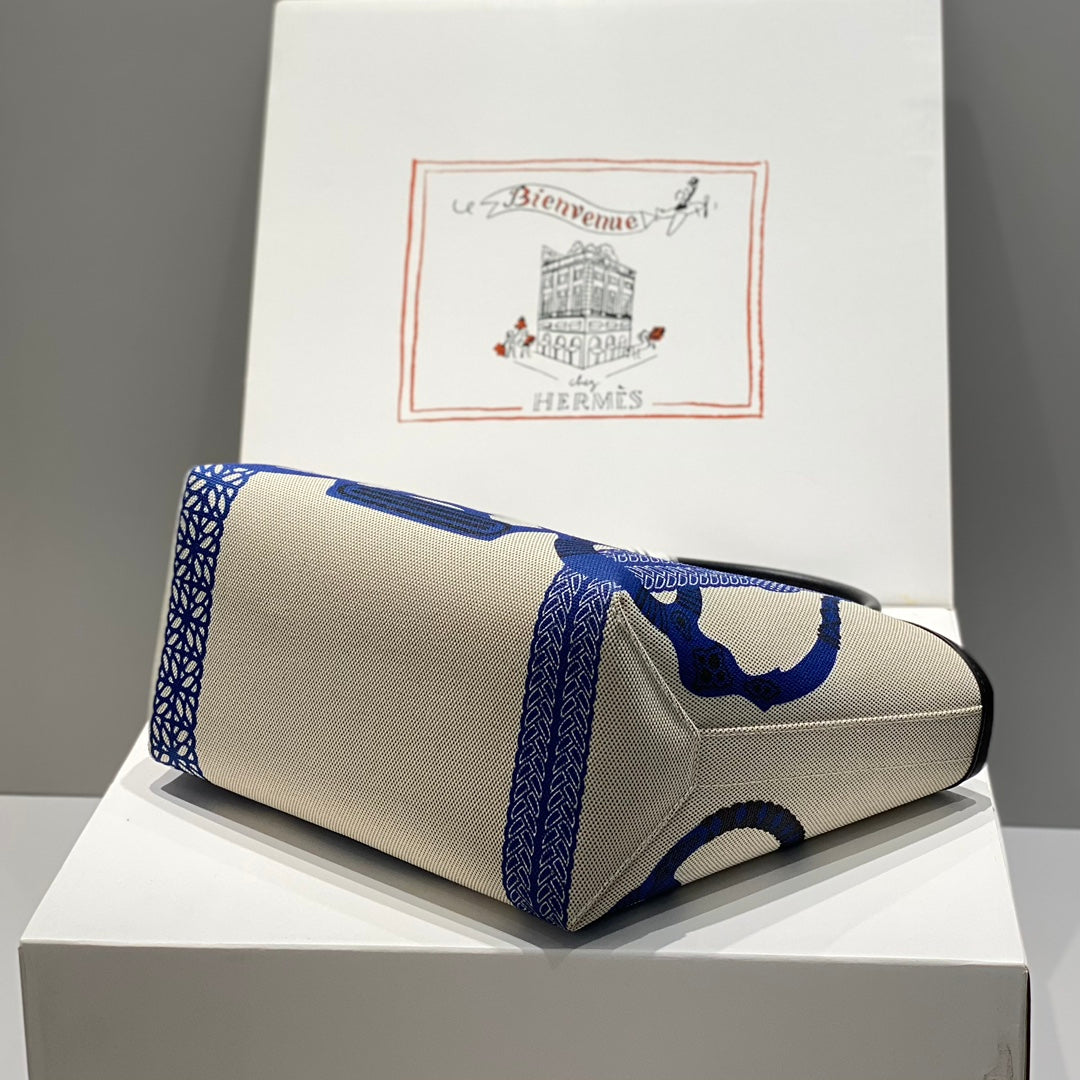 Bolso HM Steeple 28 de piel de becerro negra y lona azul y blanca