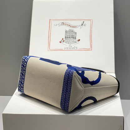 Bolso HM Steeple 28 de piel de becerro negra y lona azul y blanca