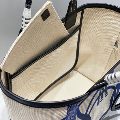 Bolso HM Steeple 28 de piel de becerro negra y lona azul y blanca