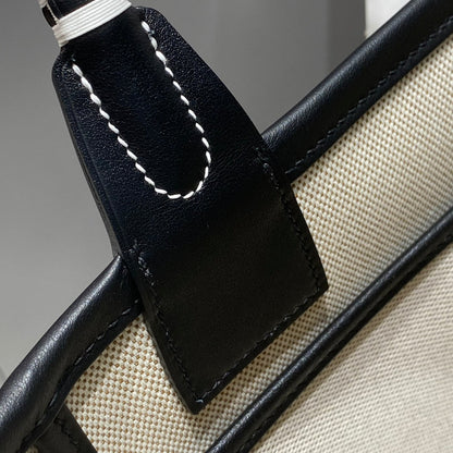 Bolso HM Steeple 28 de piel de becerro negra y lona azul y blanca