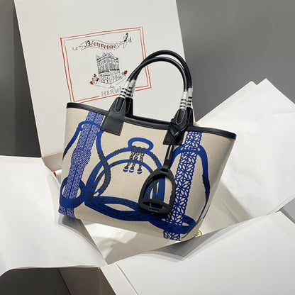 Bolso HM Steeple 28 de piel de becerro negra y lona azul y blanca
