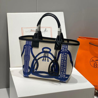 Bolso HM Steeple 28 de piel de becerro negra y lona azul y blanca