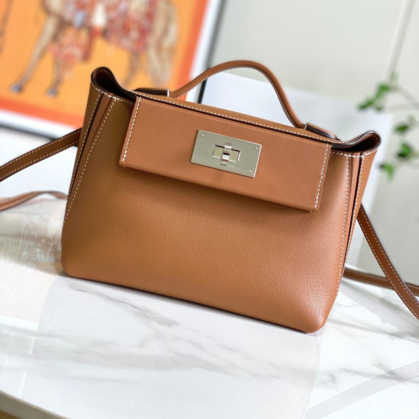 Bolso mini HM 24/24 de 21 cm, piel Evercolor dorada, herrajes plateados
